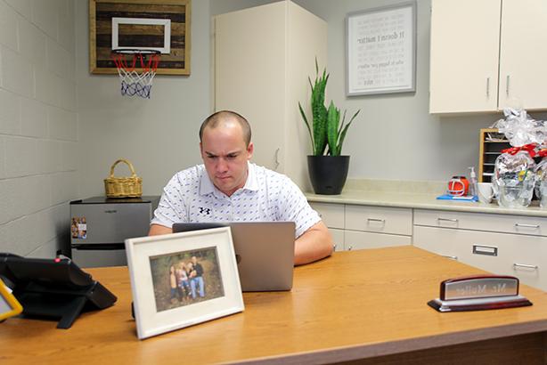 muller sitting at desk